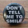 Don't Tell Me to Smile: Pinback Button, Magnet & Bottle Opener Keychain
